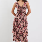 Woman wearing a floral dress on a white background