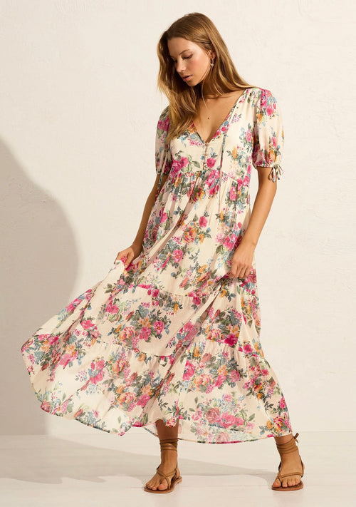 Model wears white floral maxi dress