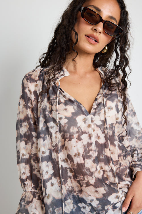 Model wears floral sheer top