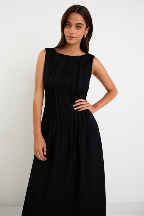 Woman wearing a black linen dress 