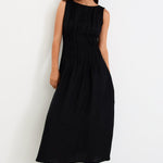 Woman wearing a black linen dress 