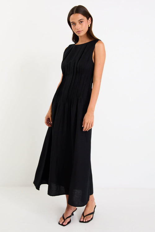 Woman wearing a black linen dress 