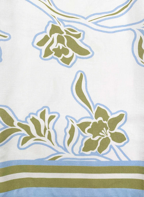 Floral pattern with green leaves and blue accents on a white background