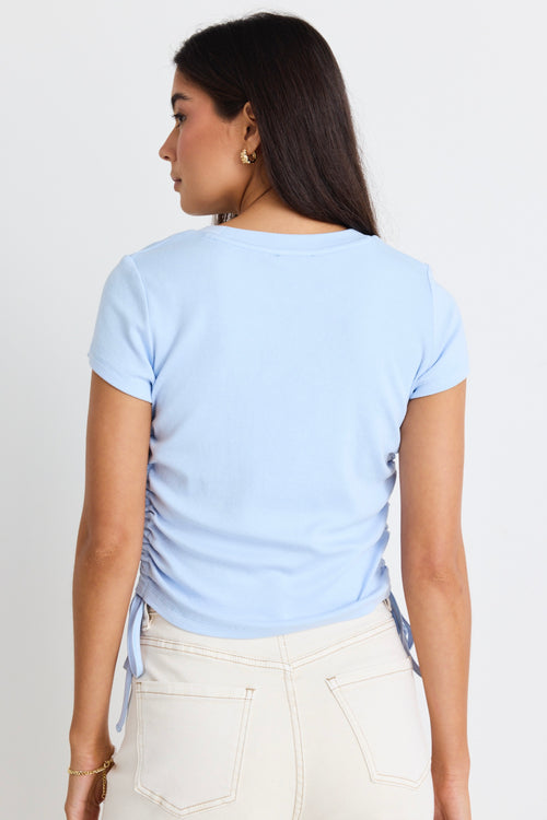 model wears a blue t-shirt