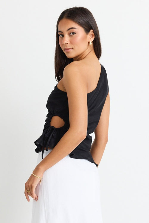 model wears a one shoulder black linen top