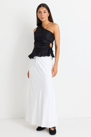 model wears a white linen maxi skirt