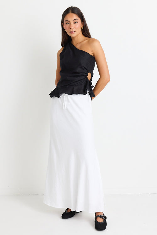 model wears a white linen maxi skirt