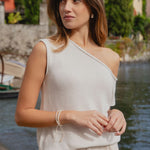 model wears a white off the shoulder top