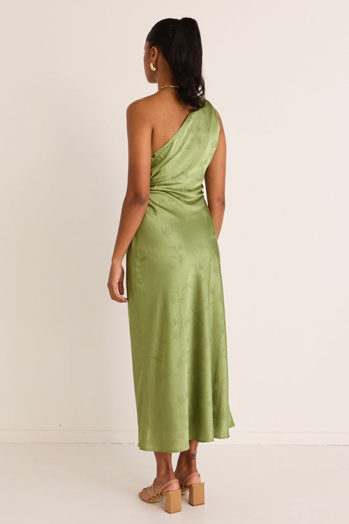 model wears a green one shoulder midi dress