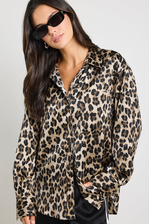 model wears a leopard print satin shirt with black satin pants