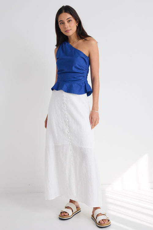 model wears white cotton linen midi skirt and blue top