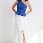 model wears white cotton linen midi skirt and blue top