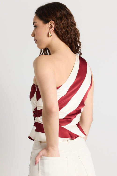 model wears a red and white stripe one shoulder