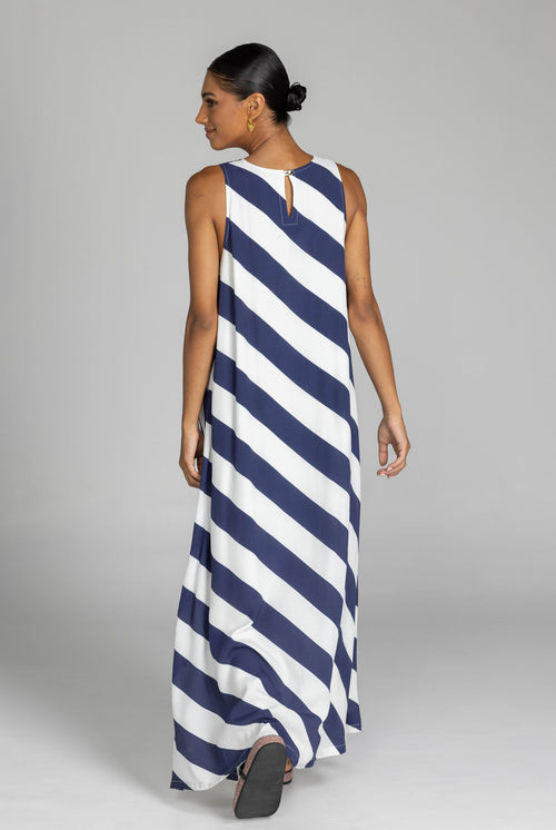 model wearing a navy and white striped maxi dress