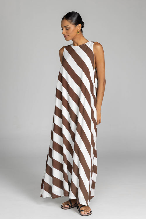 model wearing chocolate and white striped maxi dress