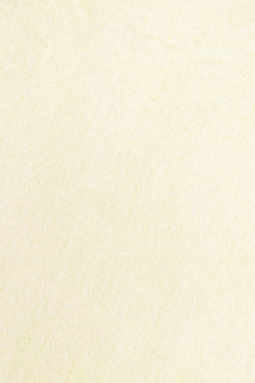 Lemon yellow coloured scarf texture close up.