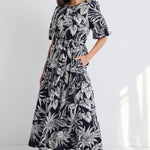 model wears a black white floral print maxi dress