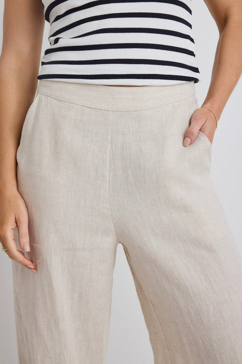 model wears beige linen pant