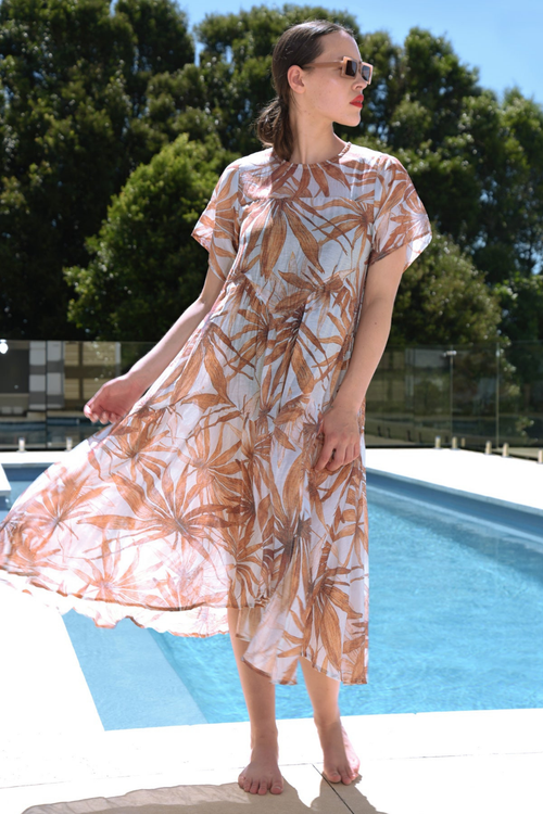 model wears floral orange dress