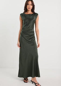 Woman wearing a green dress on a white background