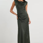 Woman wearing a green evening gown on a white background