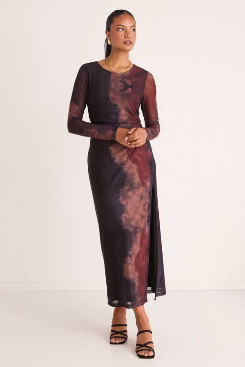 model wears a brown long sleeve dress