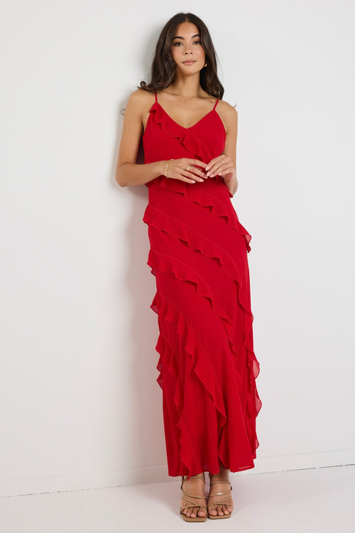 Model wears a red ruffle maxi dress 