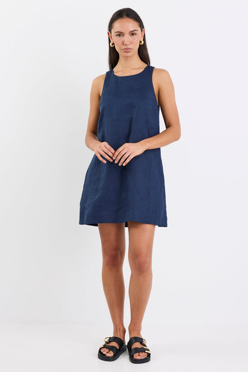 Woman wearing a blue dress on a white background