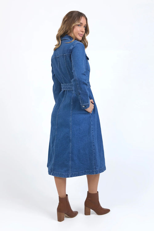 Model wears a midi blue denim dress with a tie waist and collar. 