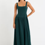 Woman wearing a green dress on a white background