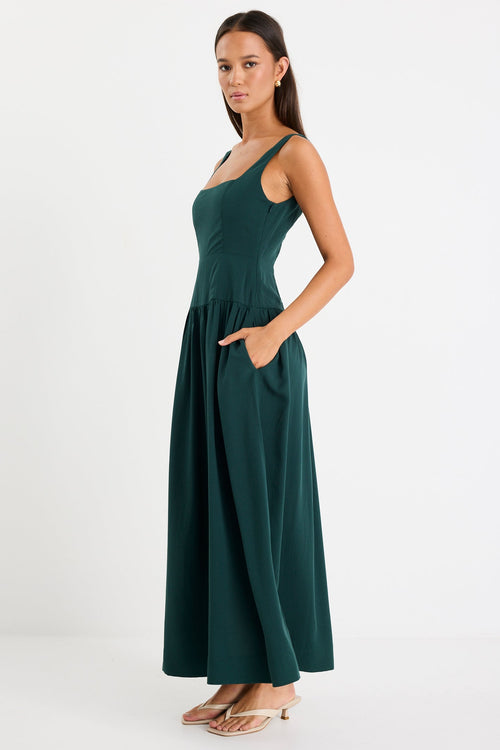 Woman wearing a green dress on a white background