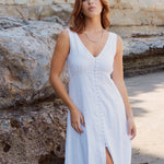 Model wears white linen sleeveless maxi dress