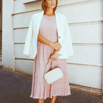 model wears a pink midi dress