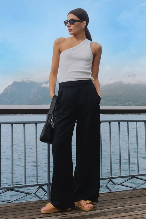 model wears black linen pants