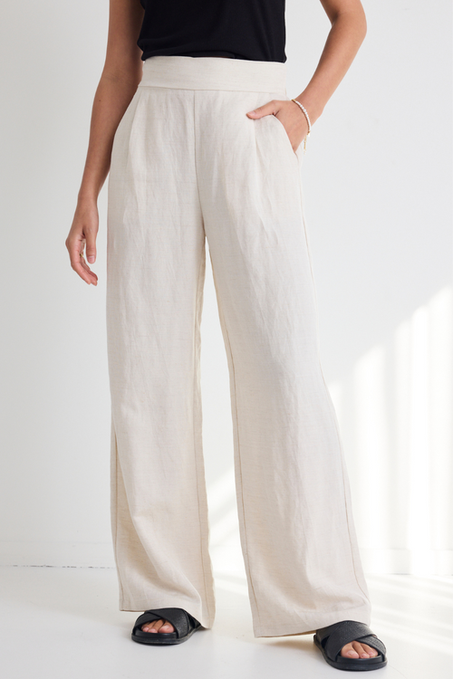 model wears Natural Linen Wide Leg Pants and a black tank top