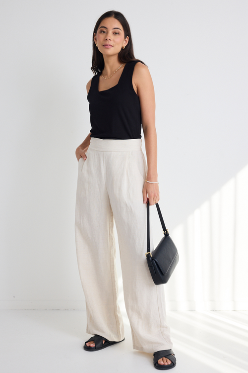 model wears Natural Linen Wide Leg Pants and a black tank top