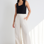 model wears Natural Linen Wide Leg Pants and a black tank top