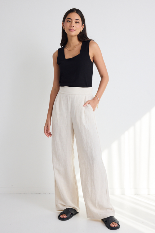 model wears Natural Linen Wide Leg Pants and a black tank top