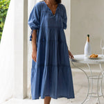 Woman wears a navy blue maxi dress