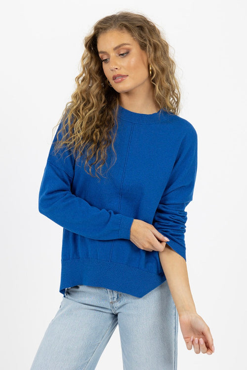 model wears a blue knit jumper