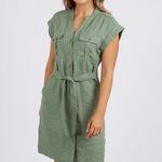 model wears green linen mini dress