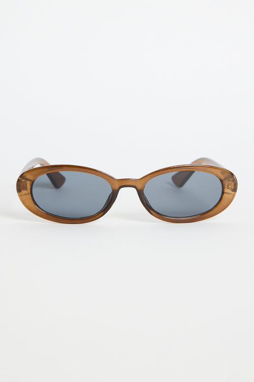 Slim oval sunglasses with a translucent espresso-brown frame and dark tinted lenses, photographed on a white background