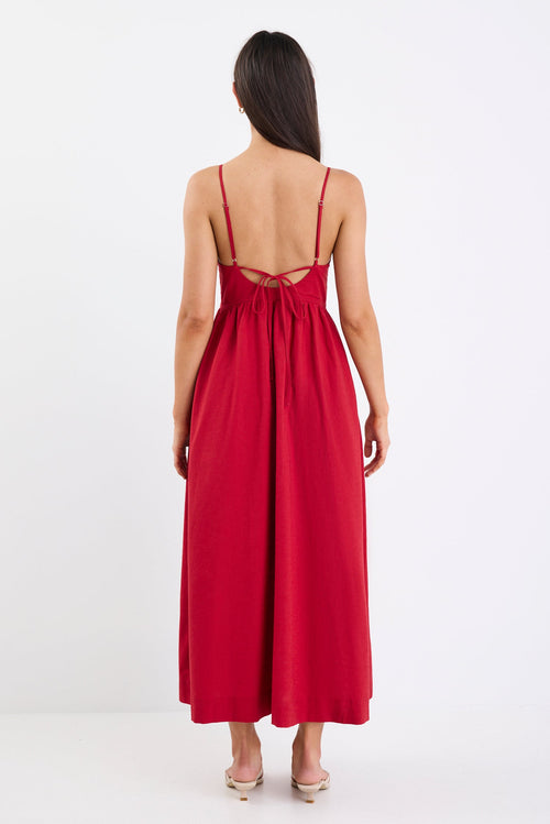 Red dress with thin straps on a white background