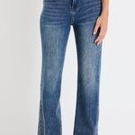 Person wearing blue jeans on a white background