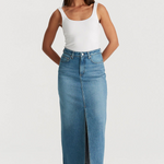 model wears blue denim maxi skirt and white tank top