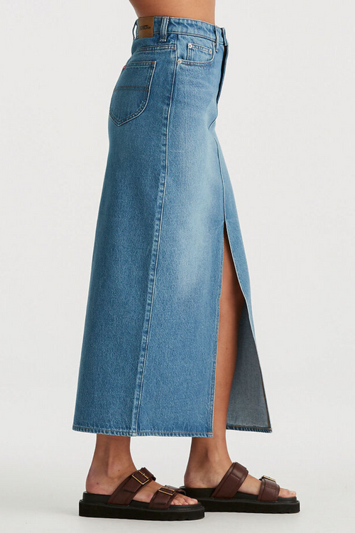 model wears blue denim maxi skirt