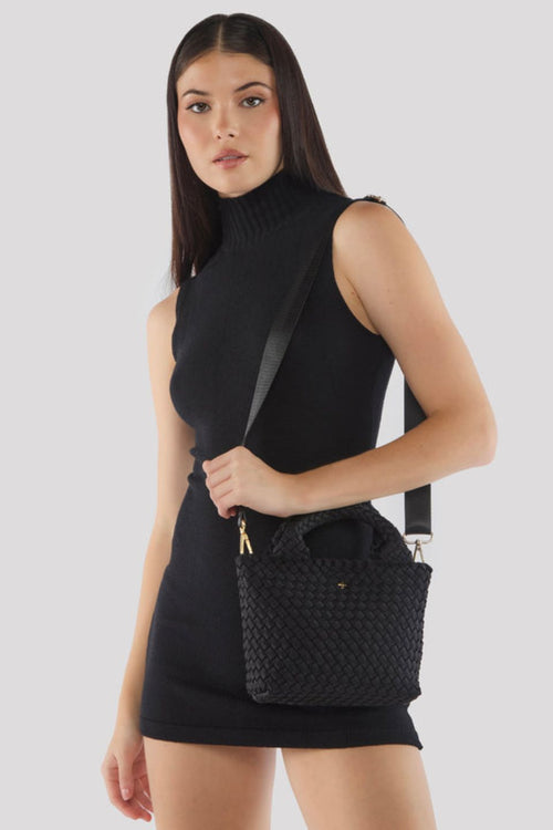 Black woven mini handbag with top handles and textured basket weave design.
