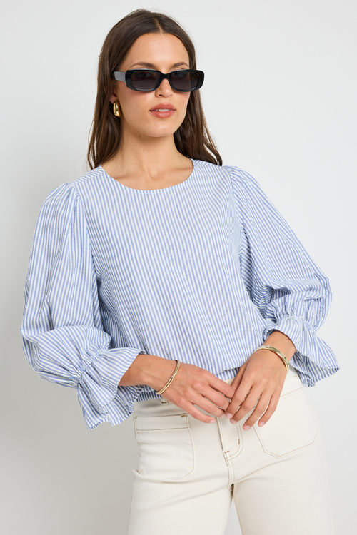 model wears blue stripe top