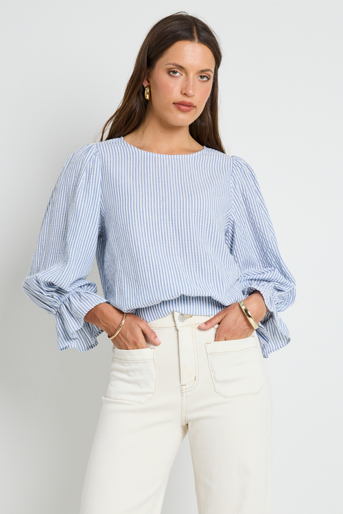 model wears blue stripe top