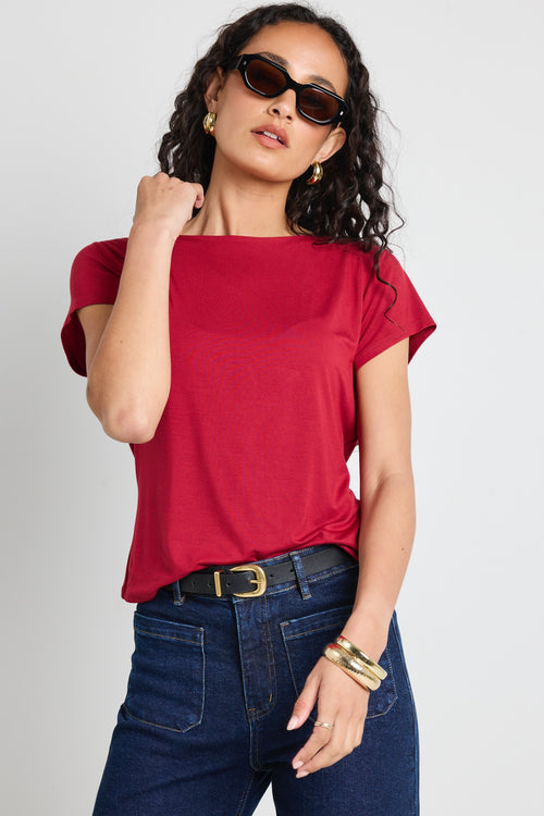 model wears a red t shirt